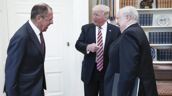 President Trump gestures to Russia's ambassador to the U.S., Sergey Kislyak, as he speaks to Russian Foreign Minister Sergey Lavrov in the Oval Office on Wednesday. photo: Alexander Shcherbak/TASS/Getty Images