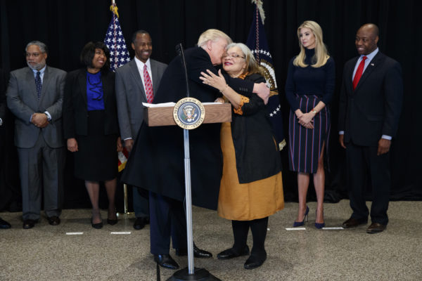 President Donald Trump hugs Alveda King, the niece of Dr. Martin Luther King Jr., while speaking after touring the National Museum of African American History and Culture, Tuesday, Feb. 21, 2017, in Washington. (AP Photo/Evan Vucci)