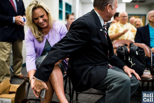 Photo: Bill Clark via Instagram Caption: Judge Roy Moore pulled out his wife's hand gun exclaiming "we carry" during an Alabama Senate candidate forum last night.