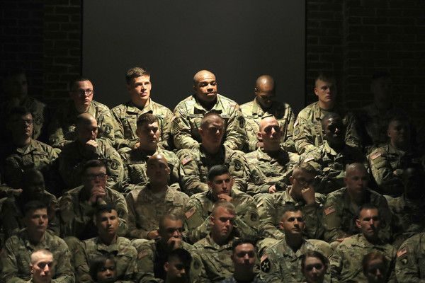 ARLINGTON, VA - AUGUST 21: U.S. military personnel listen to President Donald Trump deliver remarks on Americas involvement in Afghanistan at the Fort Myer military base on August 21, 2017 in Arlington, Virginia. Trump was expected to announce a modest increase in troop levels in Afghanistan, the result of a growing concern by the Pentagon over setbacks on the battlefield for the Afghan military against Taliban and al-Qaeda forces. (Photo by Mark Wilson/Getty Images)