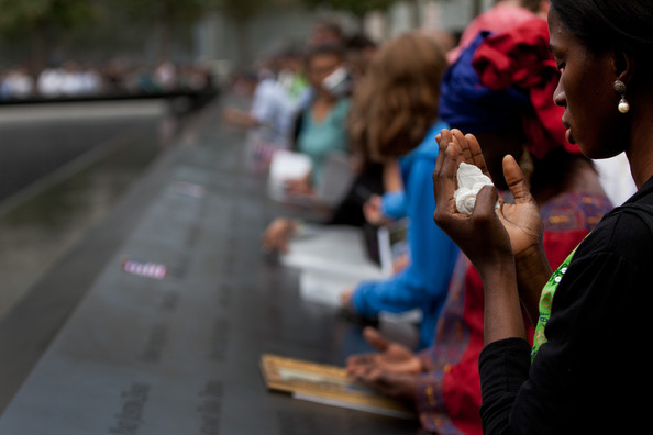 photo: Todd Heisler/Getty Images/Pool. caption: Family members visit the South Pool of the 9/11 Memorial during the tenth anniversary ceremonies of the September 11, 2001 terrorist attacks at the World Trade Center site, September 11, 2011 in New York City. New York City and the nation are commemorating the tenth anniversary of the terrorist attacks which resulted in the deaths of nearly 3,000 people after two hijacked planes crashed into the World Trade Center, one into the Pentagon in Arlington, Virginia and one crash landed in Shanksville, Pennsylvania.