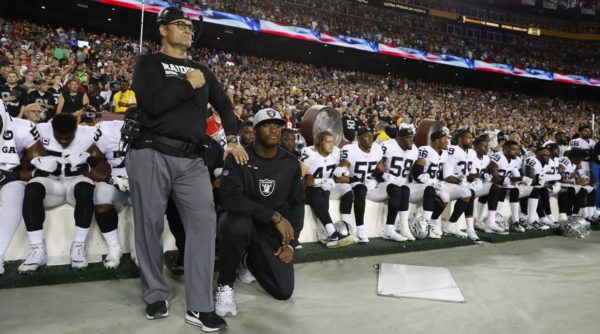 Photo: Alex Brandon, Associated Press. Some members of the Oakland Raiders kneel during the playing of the national anthem before an NFL football game against the Washington Redskins in Landover, Maryland, Sunday, Sept. 24, 2017.