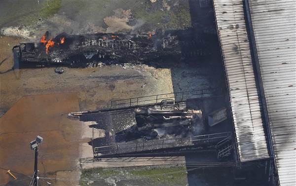 Photo: REUTERS/Andrees Latif. A fire burns at the flooded plant of French chemical maker Arkema SA in Crosby, Texas, on Aug. 31.