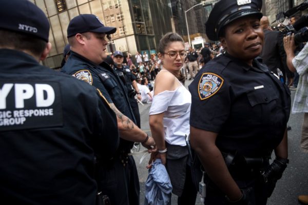 New York City Immigration activists protesting the Trump administration’s decision on the Deferred Action for Childhood Arrivals are arrested by New York City Police (NYPD) officers after they sat in the street and blocked traffic on Fifth Avenue near Trump Tower, Sept. 5, 2017. (Photo: Drew Angerer/Getty Images)