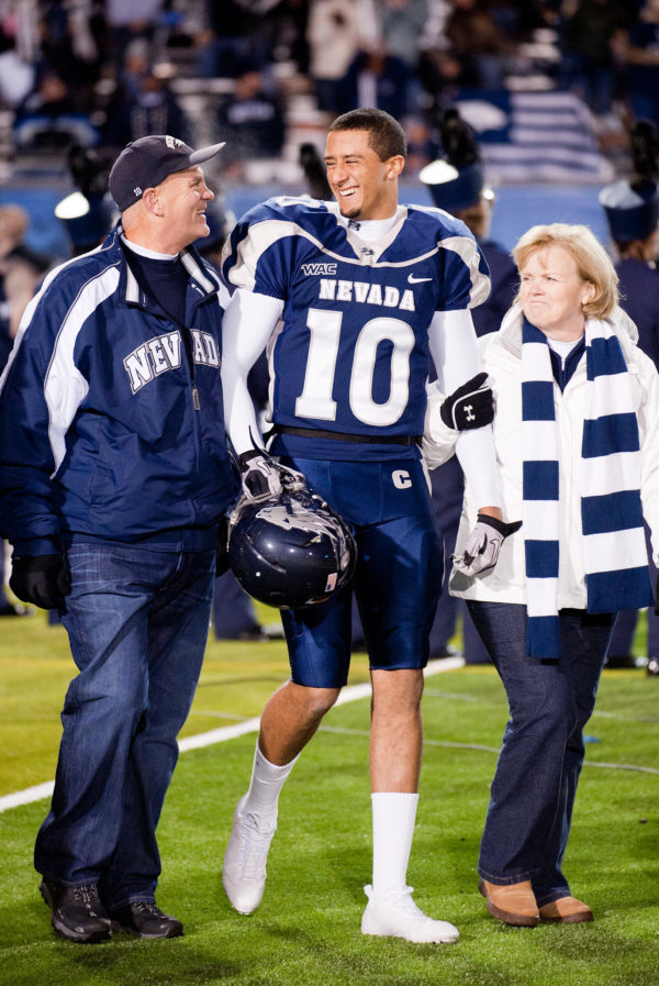 Patrick Cummings / Associated Press Caption: Kaepernick walked onto the field with his parents, Rick and Teresa, on senior night in 2010 at the University of Nevada, Reno.