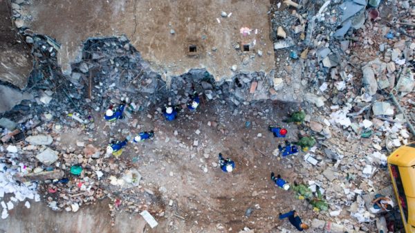 Rescuers search for survivors amid the ruins of buildings knocked down by an earthquake in Juchitan de Zaragoza, Mexico, on September 9, 2017. MARIO VAZQUEZ/AFP/GETTY IMAGES