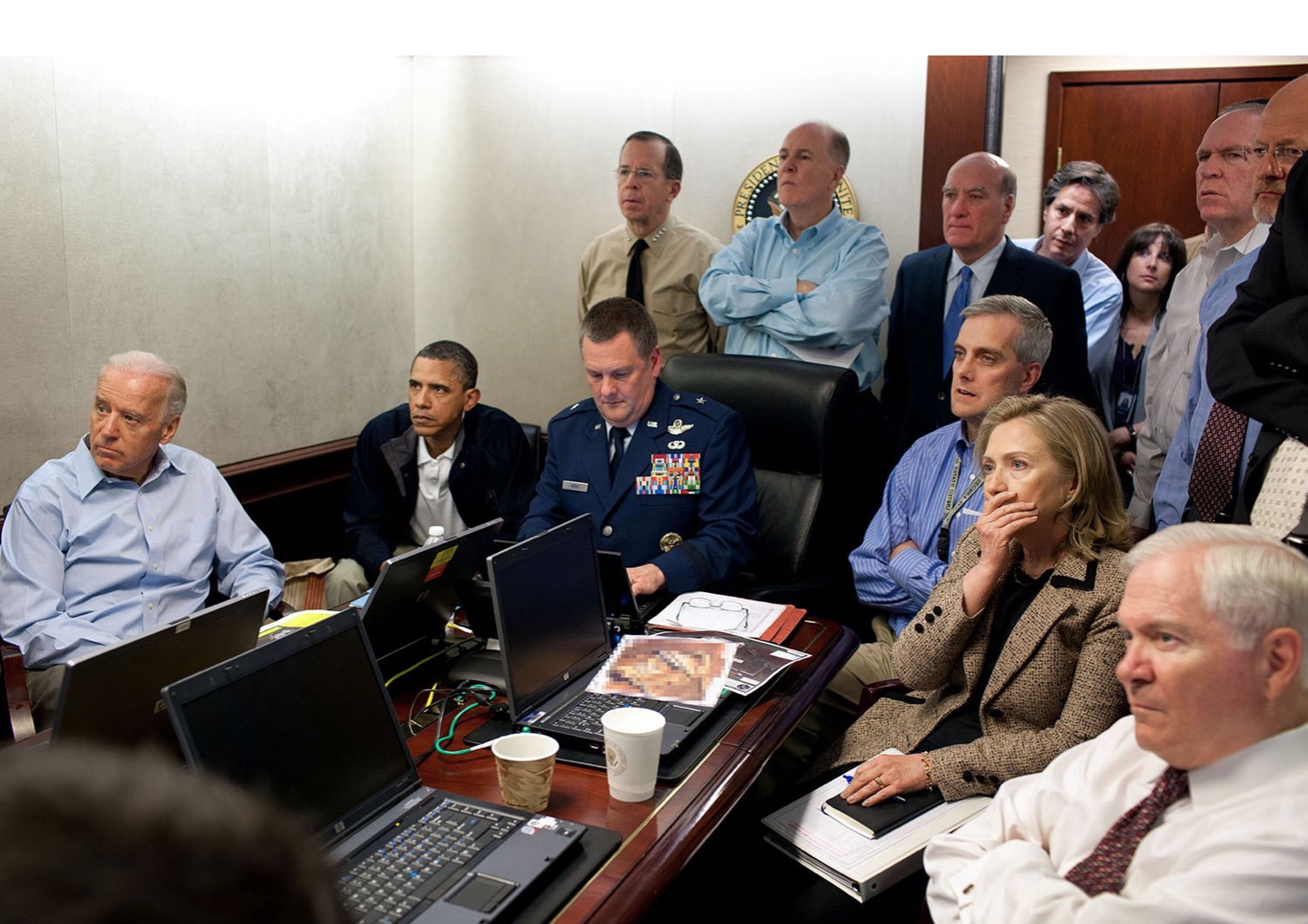 Vice President Joe Biden and President Barack Obama, along with members of the national-security team, receive an update on the mission against Osama bin Laden in the Situation Room of the White House on May 1, 2011. Please note: a classified document seen in this photograph has been obscured. (Official White House Photo by Pete Souza)