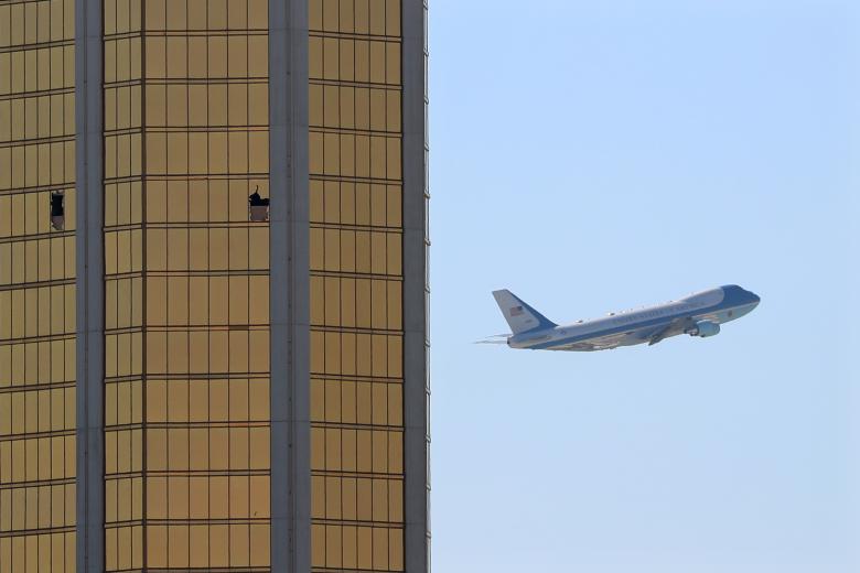 Mike Blake/Reuters. Caption: Air Force One departs Las Vegas past the broken windows on the Mandalay Bay hotel, where shooter Stephen Paddock conducted his mass shooting along the Las Vegas Strip.