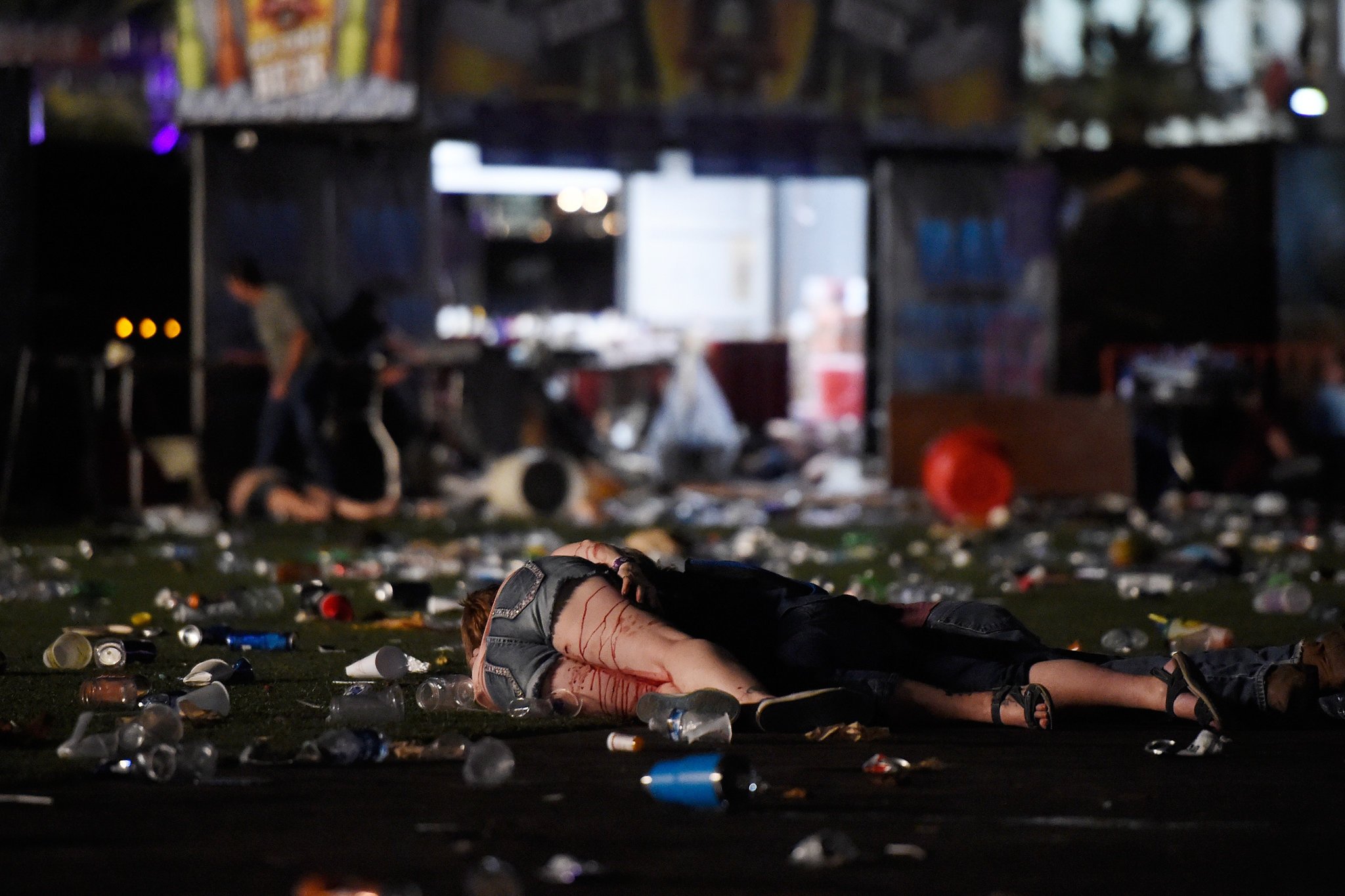 Photo: David Becker/Getty. A person lies on the ground covered with blood at the Route 91 Harvest country music festival after apparent gun fire was heard on October 1, 2017 in Las Vegas, Nevada. There are reports of an active shooter around the Mandalay Bay Resort and Casino