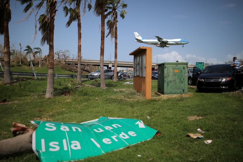 Air Force One transporting President Donald Trump lands at Luis Munoz Marin International Airport, as part of a visit to the areas affected by Hurricane Maria, in San Juan, Puerto Rico. REUTERS/Carlos Barria