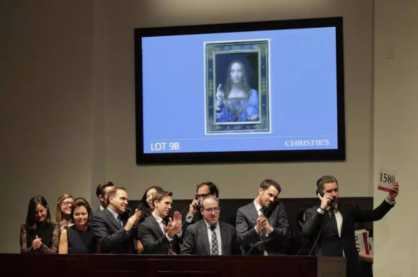 AP Photo/Julie Jacobson. Bidding representatives react after Leonardo da Vinci’s “Salvator Mundi” sold for $450 million at Christie’s, Wednesday, Nov. 15, 2017, in New York.
