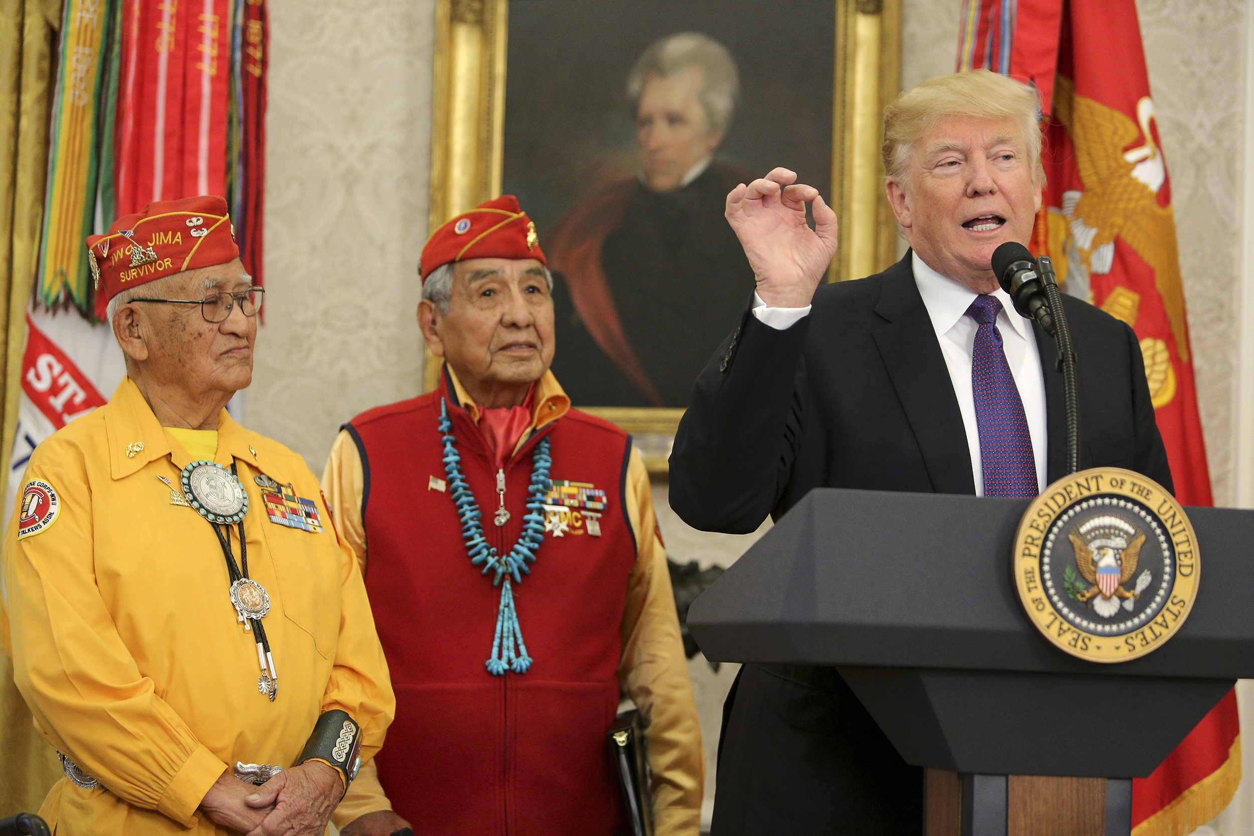 WASHINGTON, DC - NOVEMBER 27: (AFP OUT) U.S. President Donald Trump (R) speaks during an event honoring members of the Native American code talkers in the Oval Office of the White House, on November 27, 2017 in Washington, DC. Trump stated, "You were here long before any of us were here. Although we have a representative in Congress who they say was here a long time ago. They call her Pocahontas." in reference to his nickname for Sen. Elizabeth Warren. (Photo by Oliver Contreras-Pool/Getty Images)