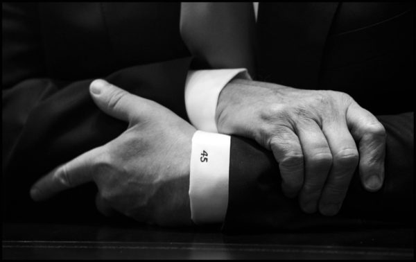 Photo: Doug Mills/ New York Times Caption: Donald Trump's hands are seen as he listens to members of congress discuss Immigration reform in the Cabinet Room of the White House.
