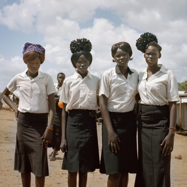 Young women in the United Nations Protection of Civilians site in Juba after church. More than 38,000 people are seeking shelter in the camp because of widespread insecurity across South Sudan. Photo: Sarah Hylton for the New York Times