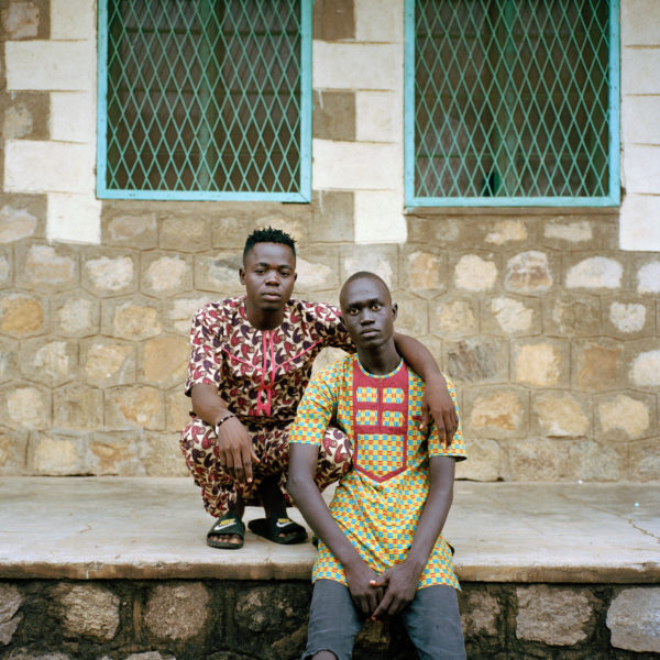 Silva, 24, and Eric, 20, wearing clothing made from traditional African textiles. Sarah Hylton for the New York Times