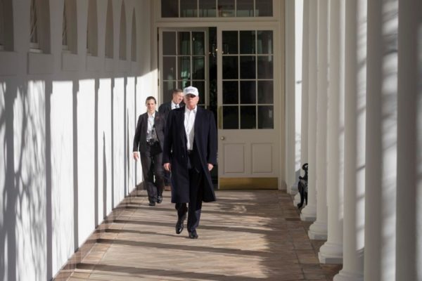 President Donald J. Trump walks along the West Wing Colonnade returning to work in the Oval Office, to continue efforts to end the Democrats government shutdown, Saturday morning, January 20, 2018, at the White House in Washington, D.C. Photo: White House