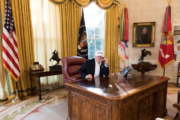 President Donald J. Trump talks on the phone in the Oval Office receiving the latest updates from Capitol Hill on negotiations to end the Democrats government shutdown, Saturday, January 20, 2018, at the White House in Washington, D.C. Photo: White House