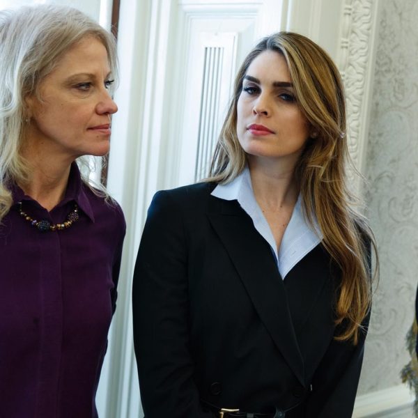 White House Communications Director Hope Hicks, right, stands with White House senior adviser Kellyanne Conway during a meeting in the Oval Office between President Donald Trump and Shane Bouvet, Friday, Feb. 9, 2018, in Washington. (AP Photo/Evan Vucci)