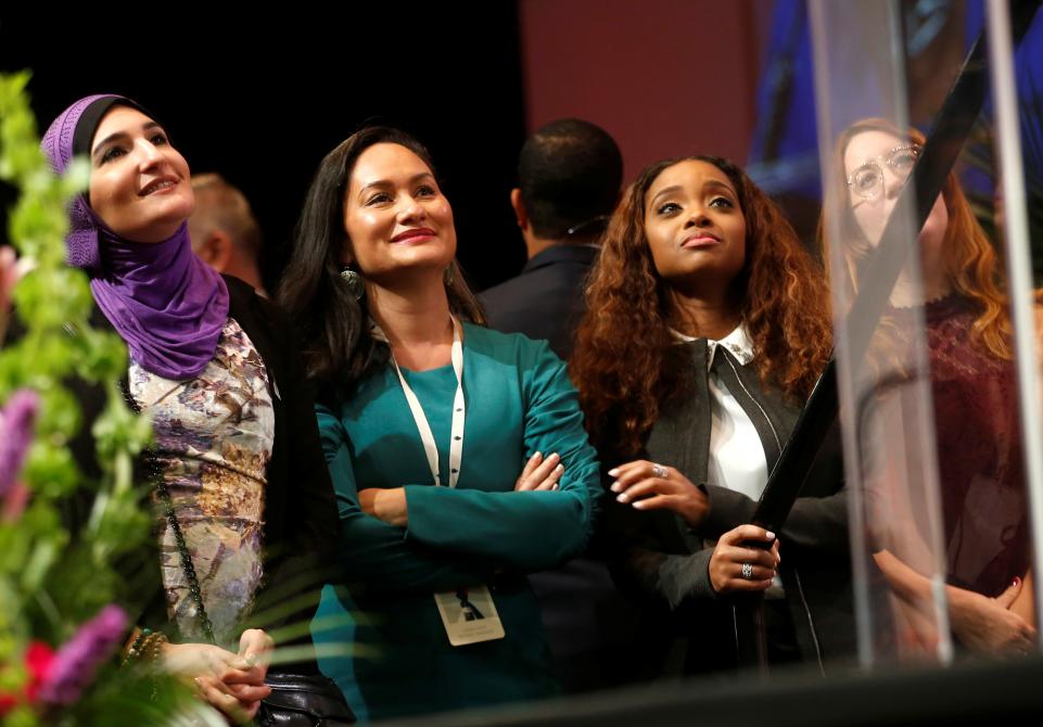 Photo 3: Rebecca Cook/Reuters. Caption: “Women's March Co-Chairs Linda Sarsour, Carmen Perez, Tamika Mallory and Bob Bland listened to Congresswoman Maxine Waters (D-Calif.) speak at the Women's Convention.”