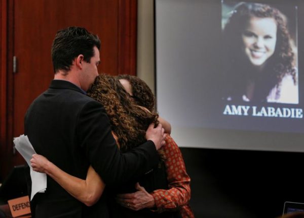 Victim Amy Labadie is comforted after speaking. REUTERS/Brendan McDermid