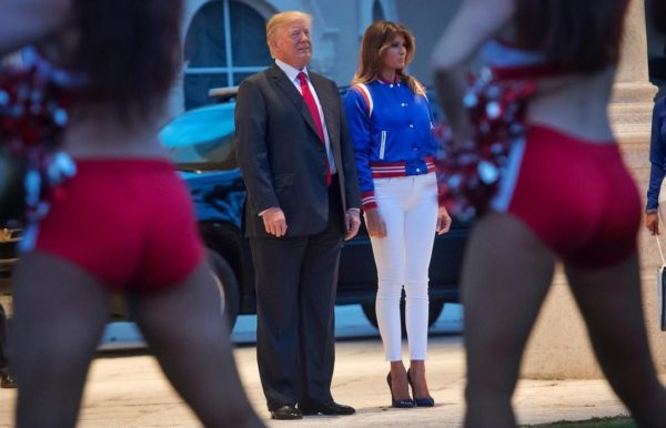 US President Donald Trump and First Lady Melania Trump watch the Florida Atlantic University Marching Band perform prior to a Super Bowl party at Trump International Golf Club in West Palm Beach, Florida, February 4, 2018. / AFP PHOTO / SAUL LOEB (Photo credit should read SAUL LOEB/AFP/Getty Images)