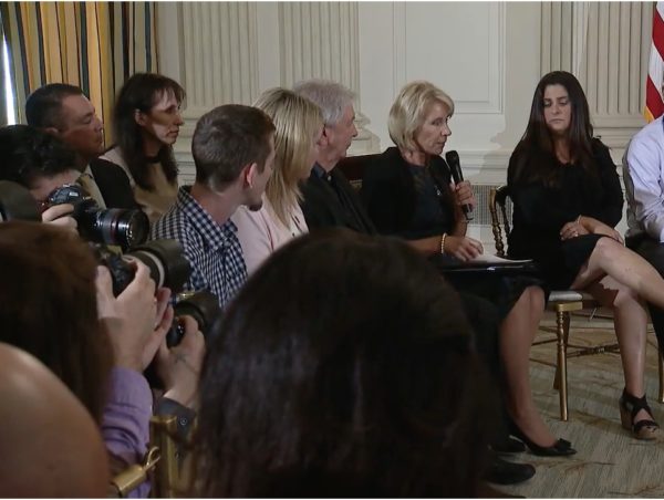 President Donald Trump holds notes during a listening session with high school students and teachers in the State Dining Room of the White House in Washington, Wednesday, Feb. 21, 2018. Screenshot via White House video.