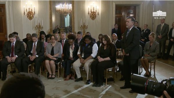 President Donald Trump holds notes during a listening session with high school students and teachers in the State Dining Room of the White House in Washington, Wednesday, Feb. 21, 2018. Screenshot via White House video.