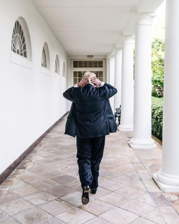 WASHINGTON, DC, UNITED STATES - MAY 8: President Donald Trump walks down the hallway into the White House residence at the end of working hours on May 8, 2017. (Photo by Benjamin Rasmussen/Getty Images Reportage)