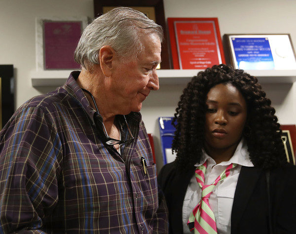 Photo: Joe Raedle/Getty Images Caption: NRA member Jim Cummings (L) walks past Marjory Stoneman Douglas High School mass shooting survivor Mei-Ling Ho-Shing,17, after speaking to the media after a gun safety roundtable discussion on March 5, 2018 in Sunrise, Florida.