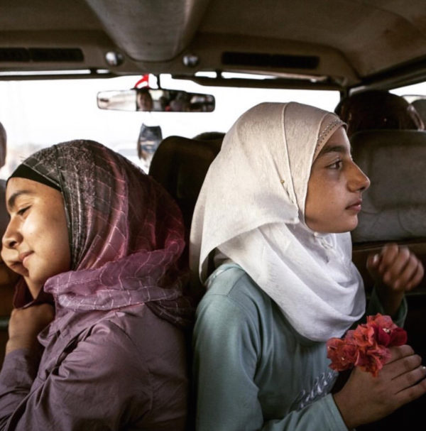 Tanya Habjouqa/Everyday Middle East Caption: Teen girls and flowers on a Gaza road trip, October 13, 2017