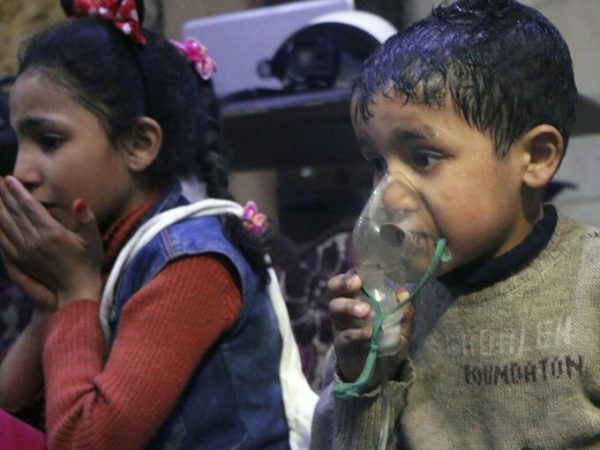 Photo: Syrian Civil Defense White Helmets/AP Caption: This image released by the Syrian Civil Defense White Helmets, shows a child receiving oxygen through respirators following an alleged poison gas attack in the rebel-held town of Douma, near Damascus, Syria.