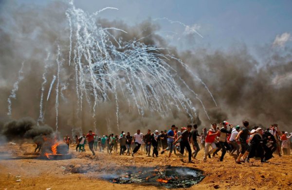 Israeli soldiers fired tear gas at Palestinian protesters.CreditMohammed Abed/Agence France-Presse — Getty Images