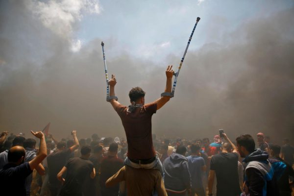 Palestinians protest against the inauguration of the US embassy in Jerusalem, as they protest near the border between Israel and the Gaza Strip, east of Jabalia. Mohammed Abed / AFP Photo