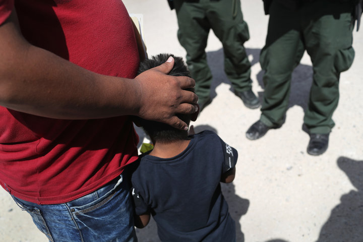 MISSION, TX - JUNE 12: U.S. Border Patrol agents take a father and son from Honduras into custody near the U.S.-Mexico border on June 12, 2018 near Mission, Texas. The asylum seekers were then sent to a U.S. Customs and Border Protection (CBP) processing center for possible separation. U.S. border authorities are executing the Trump administration's zero tolerance policy towards undocumented immigrants. U.S. Attorney General Jeff Sessions also said that domestic and gang violence in immigrants' country of origin would no longer qualify them for political-asylum status. (Photo by John Moore/Getty Images)