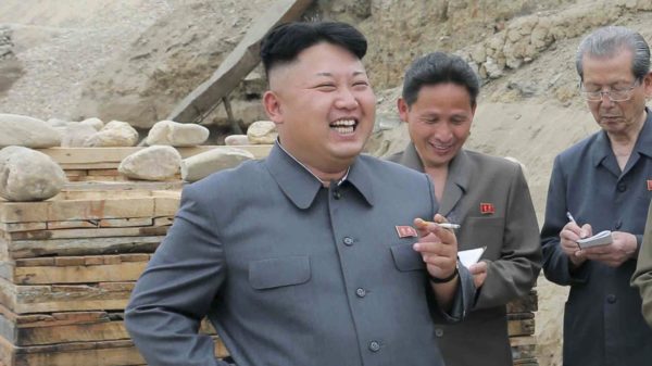 North Korean leader Kim Jong Un poses with a cigarette in an undated photo.