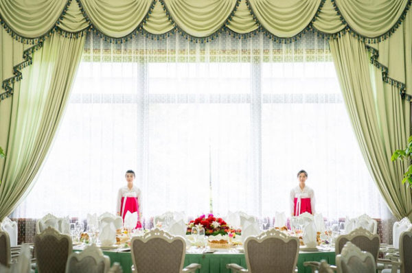 Service staff wait for the arrival of Secretary of State Mike Pompeo and Kim Yong Chol, a North Korean senior ruling party official and former intelligence chief, for a lunch at a Guest House in Pyongyang, North Korea, Saturday, July 7, 2018. (AP Photo/Andrew Harnik) 