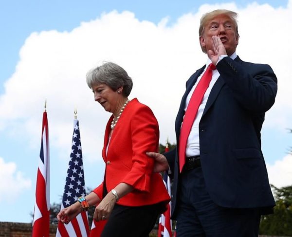 Photo: Hannah McKay/REUTERS Caption: Britain's Prime Minister Theresa May and President Donald Trump walk away after holding a joint news conference at Chequers, the official country residence of the Prime Minister, near Aylesbury, Britain.