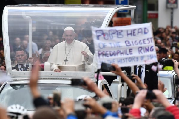 Photo: Ben STANSALL / AFP. Caption: Pope Francis waves to the faithful on his popemobile in Dublin on August 25, 2018, during his visit to Ireland to attend the 2018 World Meeting of Families.