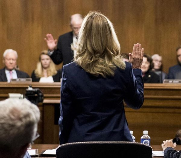 Christine Blasey Ford is sworn in before testifying to the Senate judiciary committee in the Dirksen Senate Office Building. September 27, 2018.