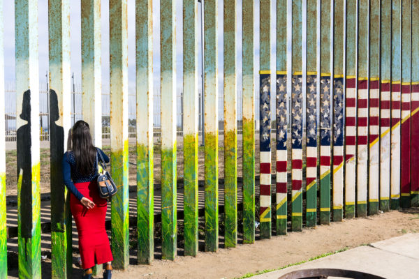 September 22, 2017 Women looking through the fence in Tijuana, México talking to family member in the U.S. side. Photo: Nick Oza