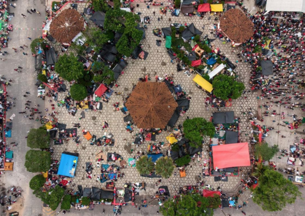 Photo: Guillermo Arias/AFP/Getty Images Caption: Honduran migrants camps at the main square of San Pedro Tapanatepec on Oct. 28. 2018