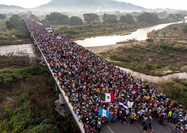 Photo: Guillermo Arias /AFP/Getty Images Caption: Aerial view of Honduran migrants heading in a caravan to the US, as the leave Arriaga on their way to San Pedro Tapanatepec, in southern Mexico on October 27, 2018. - Mexico on Friday announced it will offer Central American migrants medical care, education for their children and access to temporary jobs as long as they stay in two southern states.