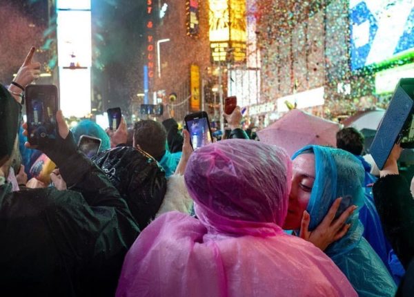 Photo: Craig Ruttle /Associated Press Embracing a (very rainy) New Year in New York, with lots of affection. December 31, 2018.
