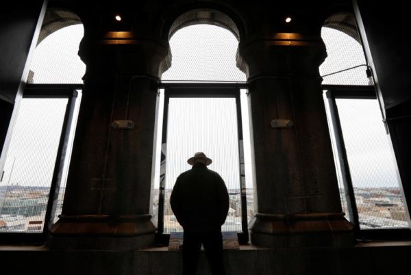 A National Park Service ranger looks out onto the city from Trump International Hotel's historic clock tower, which remains open and staffed by the National Park Service despite the partial government shutdown in Washington, January 7. REUTERS/Kevin Lamarque