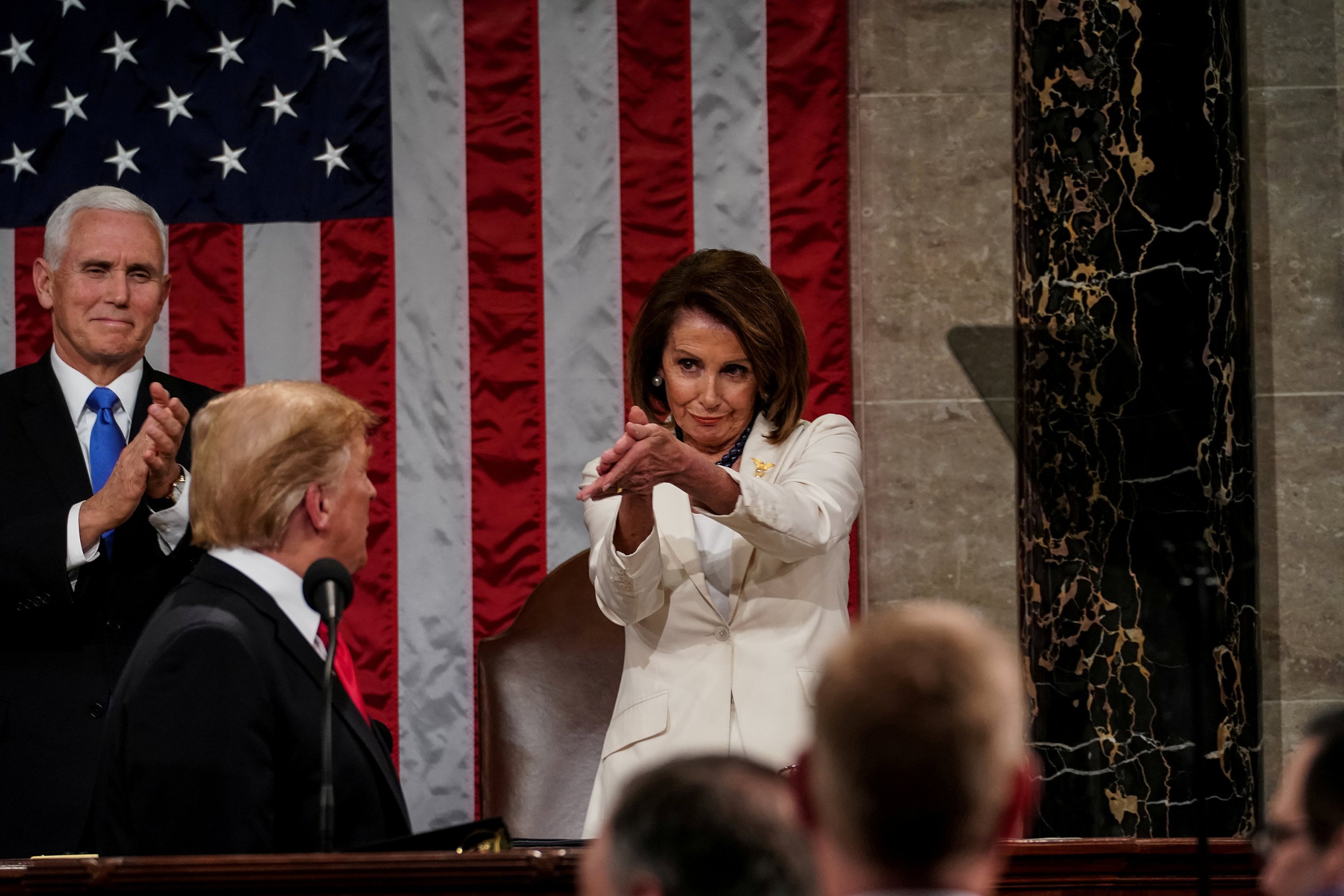 Chatting the Pictures: Pelosi’s Trump Clap; Double Border Fences; Male Super Bowl Cheerleaders