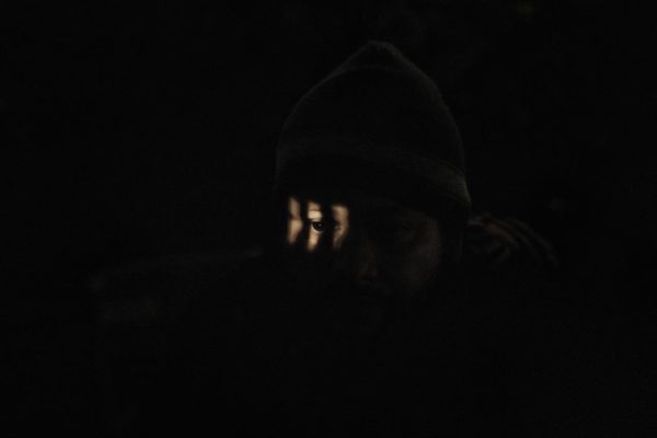 Photo: Daniel Ochoa de Olza/AP Photo Caption: A migrant looks trough a hole in a border fence as he attempts to get into the U.S. side to San Diego, Calif., from Tijuana, Mexico, Tuesday, Jan. 1, 2019. Discouraged by the long wait to apply for asylum through official ports of entry, many migrants are choosing to cross the U.S. border wall and hand themselves in to border patrol agents.