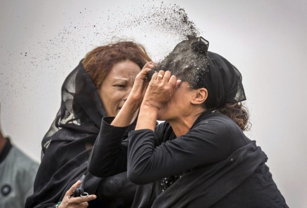Photo: Mulugeta Ayene/AP. Caption: An Ethiopian relative of a crash victim throws dirt in her own face after realising that there is nothing physical left of her loved one, as she mourns at the scene where the Ethiopian Airlines Boeing 737 Max 8 crashed shortly after takeoff on Sunday killing all 157 on board, near Bishoftu, south-east of Addis Ababa, in Ethiopia Thursday, March 14, 2019. About 200 family members of people who died on the crashed jet stormed out of a briefing with Ethiopian Airlines officials in Addis Ababa on Thursday, complaining that the airline has not given them adequate information.