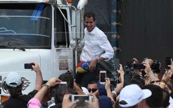 epa07390824 Venezuelan Parliament President Juan Guaido greets people from a truck in Cucuta, Colombia, 23 February 2019. Guaido called today to the Venezuelan Armed Forces to put on the 'right side of history' and allow the entry of the 14 trucks that departed from Cucuta with 280 tons of humanitarian aid. EPA-EFE/MAURICIO DUENAS CASTANEDA