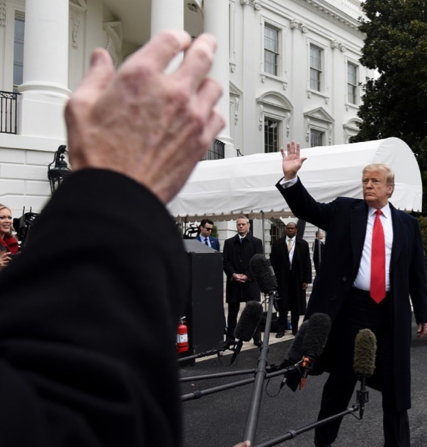 US President Donald Trump waves as a reporter tries to ask a question while departing the White House on Friday, March 22, 2019. Photo by Olivier Douliery