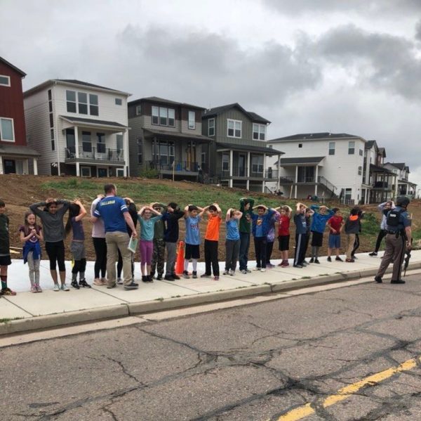 Students near STEM School Highlands Ranch lined up during a shooting at the Colorado school that left one dead and eight injured on Tuesday, May 7, 2019. Photo: Shreya Nallapati